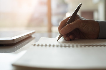 person taking notes in notebook